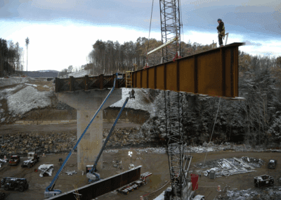 Setting a girder at Bedford-Manchester-Londonderry Bridge