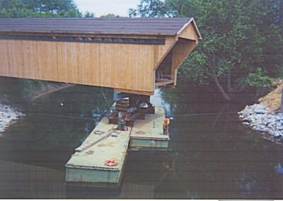 Floating Historic Proctor Bridge back in place